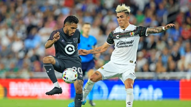 Aug 10, 2022; Saint Paul, MN, USA; MLS forward Jesus Ferreira (20) of FC Dallas moves the ball against Liga MX defender Luis Reyes (14) of Atlas during the MLS All-Star Game at Allianz Field. Mandatory Credit: Aaron Doster-USA TODAY Sports